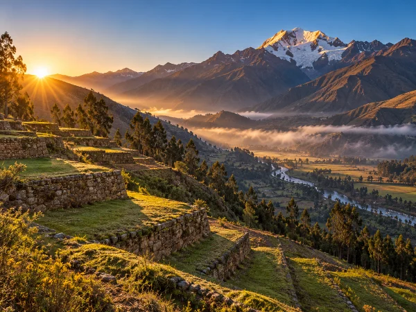 Sacred Valley stone terraces at sunrise below a snowcapped peak, where altitude can mimic rapé effects